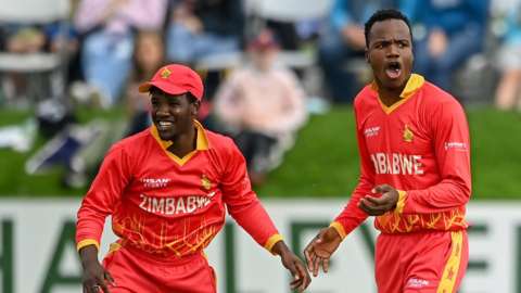 Zimbabwe's Milton Shumba (right) celebrates a wicket