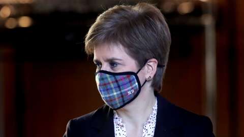 Nicola Sturgeon wearing a tartan face mask