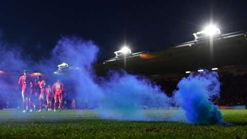 A flare is thrown after Wigan score