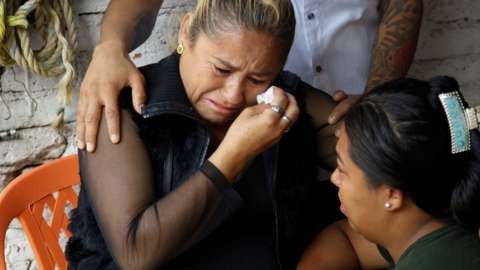 Laura Zalazar in Cortazar, Mexico, cries as she awaits official notification that her son is among the 53 migrants who died inside a trailer in San Antonio, Texas