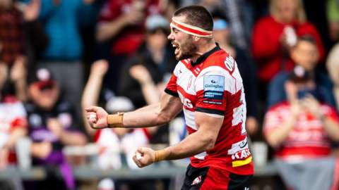 Lewis Ludlow celebrates his try for Gloucester
