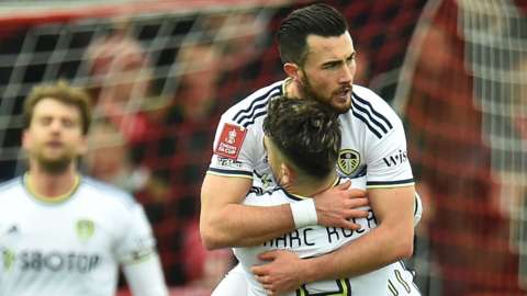 Leeds United's Jack Harrison celebrates his goal in the FA Cup fourth-round tie against Accrington Stanley with Marc Roja