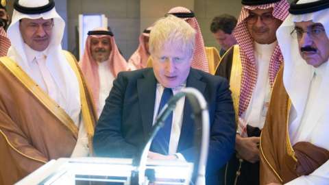 Boris Johnson visiting a manufacturing plant in Saudi Arabia
