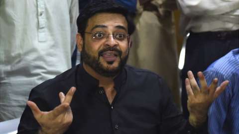 In this picture taken on July 11, 2018, Aamir Liaquat Hussain, a televangelist and an election candidate of the political party Pakistan Tehreek-e-Insaf (Movement for Justice) of Imran Khan, gestures as he speaks with students during an election campaign in Karachi.