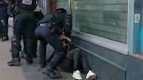 Footage shows Paris police officer punch protester