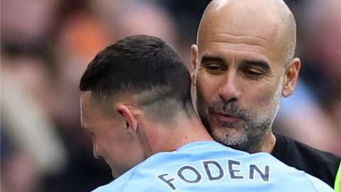 Manchester City boss Pep Guardiola and forward Phil Foden