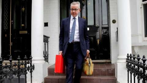 Michael Gove leaving his home