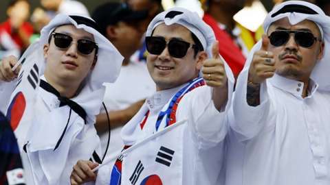 South Korean fans in Arabic dress