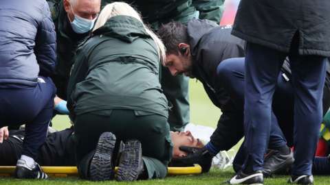 Neil Etheridge receives treatment at the City Ground