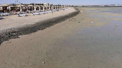 Empty sunbeds are seen during a low tide at the beach of the Red Sea resort of Sahl Hasheesh, Hurghada