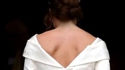 Princess Eugenie shown in her wedding dress from the back