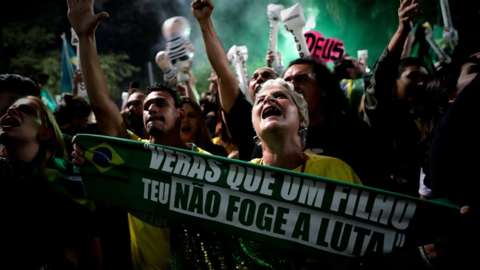 Supporters of Brazilian far-right presidential candidate Jair Bolsonaro celebrate his victory at the Paulista Avenue, in Sao Paulo, Brazil, 28 October 2018.