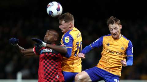 Hartlepool remain in the relegation places despite fighting back for a point against Mansfield