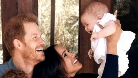 The Duke and Duchess of Sussex with Lilibet (held up) and Archie