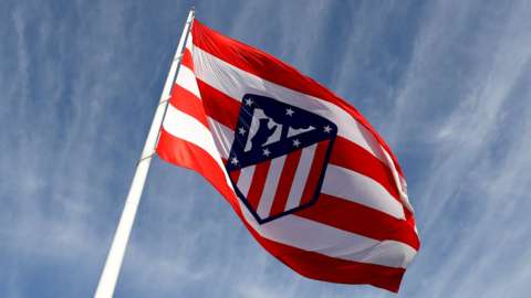 Atletico Madrid badge on a flag