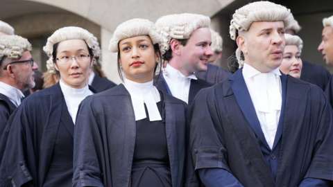 Barristers in wigs picket outside the Old Bailey in central London