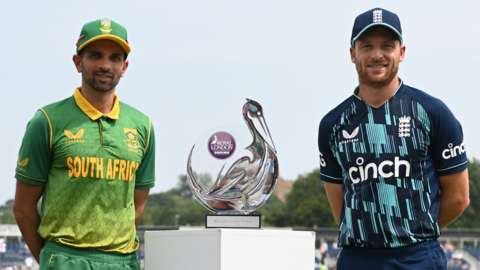 South Africa captain Keshav Maharaj (left) and England skipper Jos Buttler (right) stand beside the ODI trophy