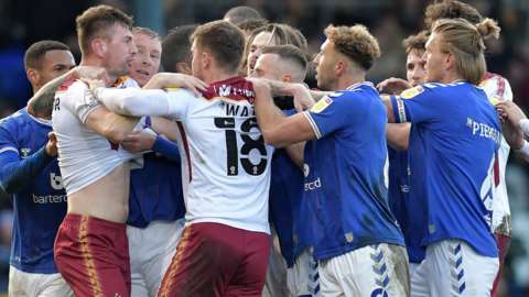 Bradford and Oldham players scuffle