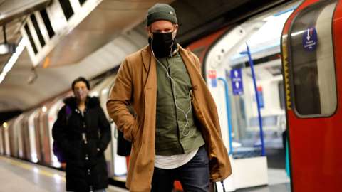 Passengers wearing face masks on the London Underground