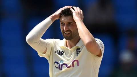 England fast bowler Mark Wood puts his head in his hands