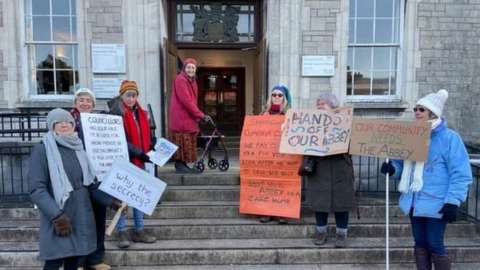 Campaigners outside Cumbria County Council in December 2022