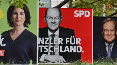 Billboards with election campaign posters showing the three chancellor candidates: co-leader of Germany's Greens (Die Gruenen) Annalena Baerbock; German Finance Minister and Vice-Chancellor of the Social Democratic SPD Party Olaf Scholz; and Christian Democratic Union CDU leader Armin Laschet