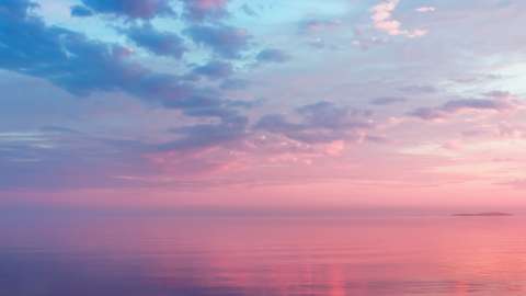 Purple and pink sunset over water