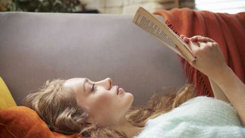 A woman reading a book