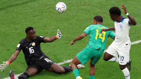 Senegal goalkeeper Edouard Mendy fails is beaten by Bukayo Saka for England's third goal