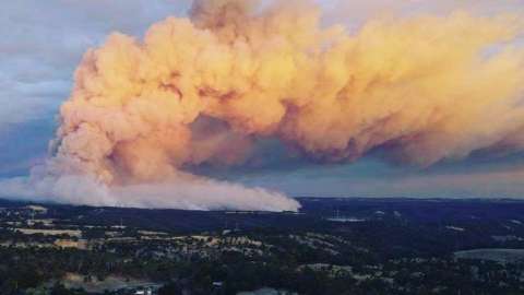Orange smoke clouds from the Cherry Garden bushfire seen covering the sky