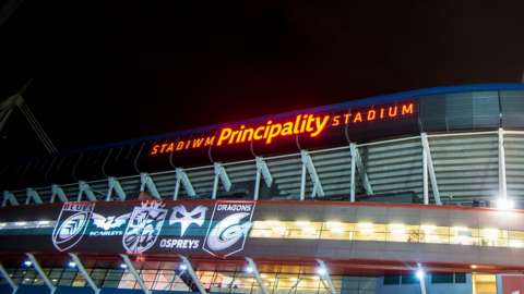 Regions' crests projected on the Principality Stadium