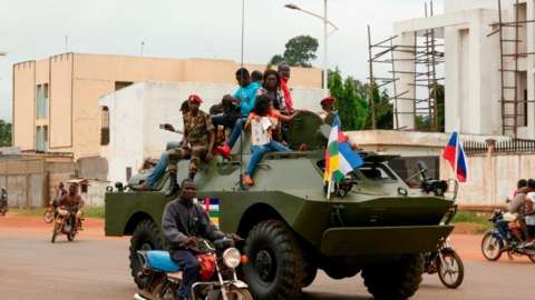 A Russian armoured personnel carrier (APC) is seen driving in the street during the delivery of armoured vehicles to the Central African Republic army in Bangu
