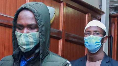 Hussein Hassann Mustafah (L) and Mohamed Ahmed Andayi (R) leave the dock after they were found guilty of aiding gunmen in the Westgate Mall attack at a Milimani court, Nairobi, Kenya, 07 October 2020.