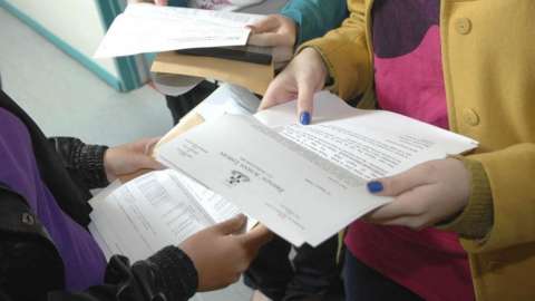 pupils holding result letters