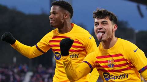 Pedri celebrates putting Barcelona ahead against Girona in La Liga with Ansu Fati