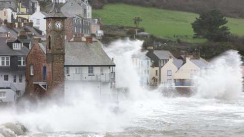 Storms and high seas affecting a village
