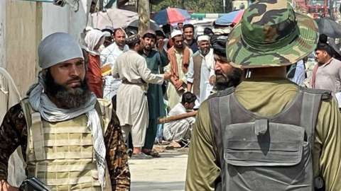 Taliban and Pakistani border guards at Torkham border