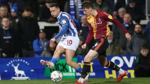 Luke Molyneux of Hartlepool United in action with Matty Foulds of Bradford City