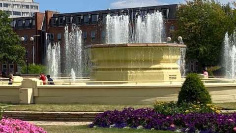Children play in the Rose Bowl fountain in Hull's Queens Gardens on Monday
