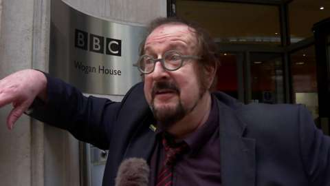 Steve Wright leaning on BBC Wogan House