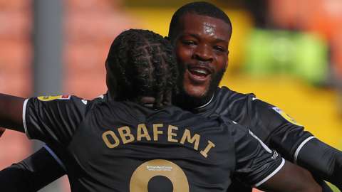 Olivier Ntcham celebrates with Michael Obafemi