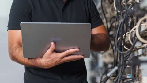 A stock image of computers mining cryptocurrency