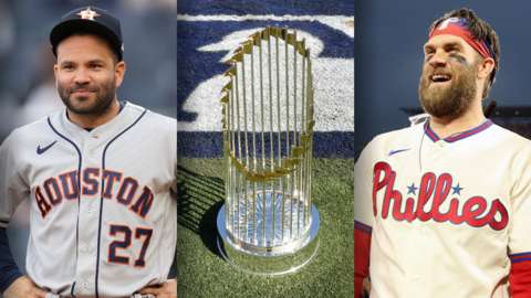 Houston Astros' Jose Altive, the World Series trophy and Philadelphia Phillies' Bryce Harper