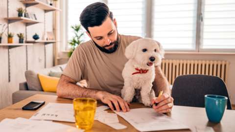 Man and dog with bills