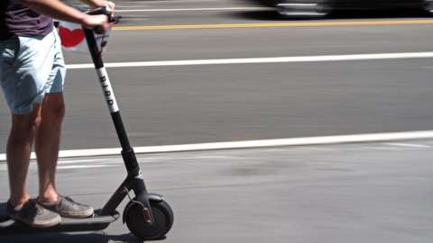 A person riding an e-scooter