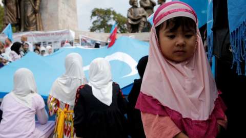 Ethnic Uyghur girls attend a protest against China, in Istanbul, Turkey, 31 August 2022