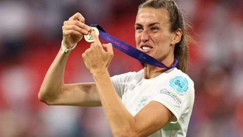 England's Jill Scott celebrates with a medal after winning the women's Euro 2022