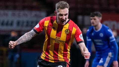 Kevin Holt celebrates after scoring a penalty for Partick Thistle against Queen of the South