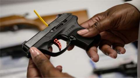 A Ruger pistol, or handgun, is displayed during a gun 'buyback' event held by the New York Police Department (NYPD) and the office of the Attorney General, in the New York borough of Brooklyn on May 22, 2021.