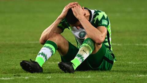 Nigeria defender Leon Balogun reacts to their World Cup qualifying exit